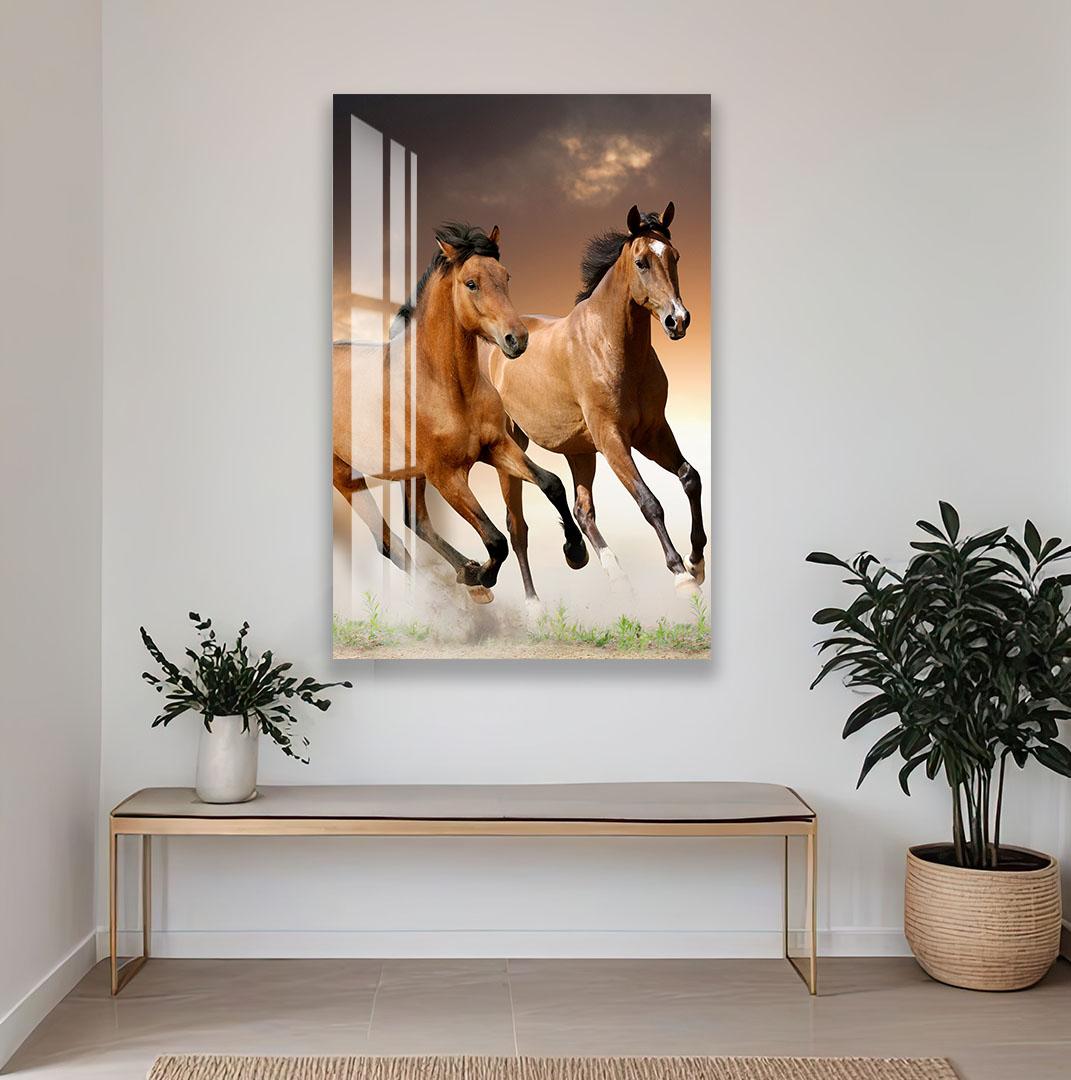 a large, close-up photograph of a leopard with its distinctive spotted coat, displayed on a wall above a wooden bench and a potted plant.