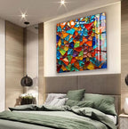 a modern bedroom with a large, colorful mosaic artwork hanging on the wall above the bed.