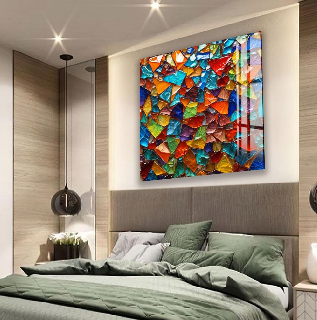 a modern bedroom with a large, colorful mosaic artwork hanging on the wall above the bed.