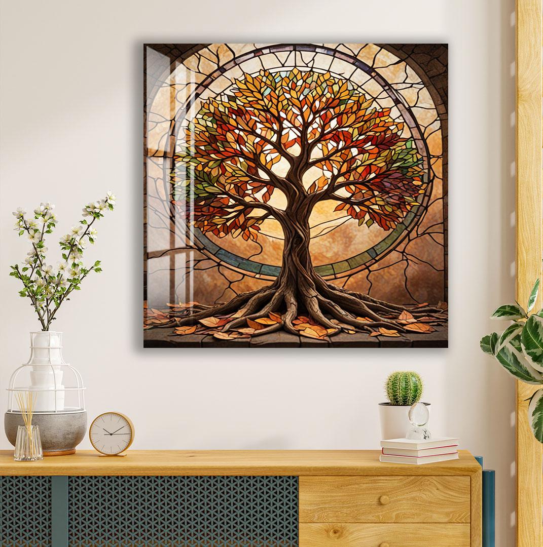 a large, colorful stained glass tree with a brown trunk and vibrant leaves, set against a brown background with a circular window. The tree is surrounded by a variety of plants and decorative items, including a clock, a vase, and a stack of books.