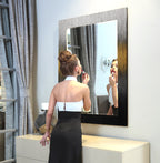 Round center decorative glass mirror with metallic black and gold gradient frame.