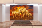 a painting of a family of elephants in front of a sunset