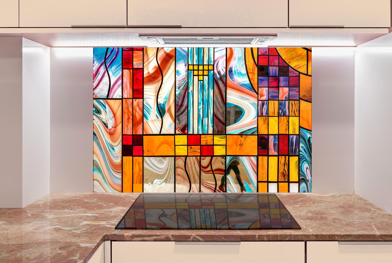a modern kitchen with a large, colorful stained glass wall behind the countertop.