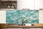 a kitchen with a sink, cabinets and a mosaic tile backsplash