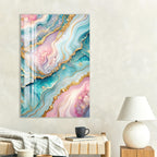 a vibrant abstract painting with swirling patterns in shades of blue, pink, and gold, hanging on a wall above a wooden table with a lamp and a coffee cup.