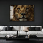 a large, close-up photograph of a majestic lion's face, mounted on a wall above a modern, minimalist living room setting with a white sofa and a glass coffee table.