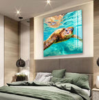 a large elephant head photograph displayed on the wall above a bed with a green comforter.