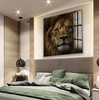 a large, framed photograph of a lion's face on the wall above a bed with a green comforter.
