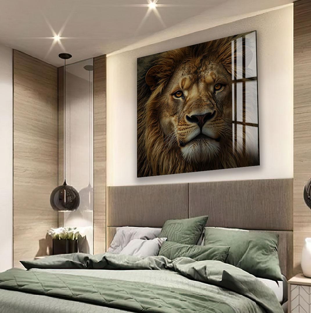 a large, framed photograph of a lion's face on the wall above a bed with a green comforter.