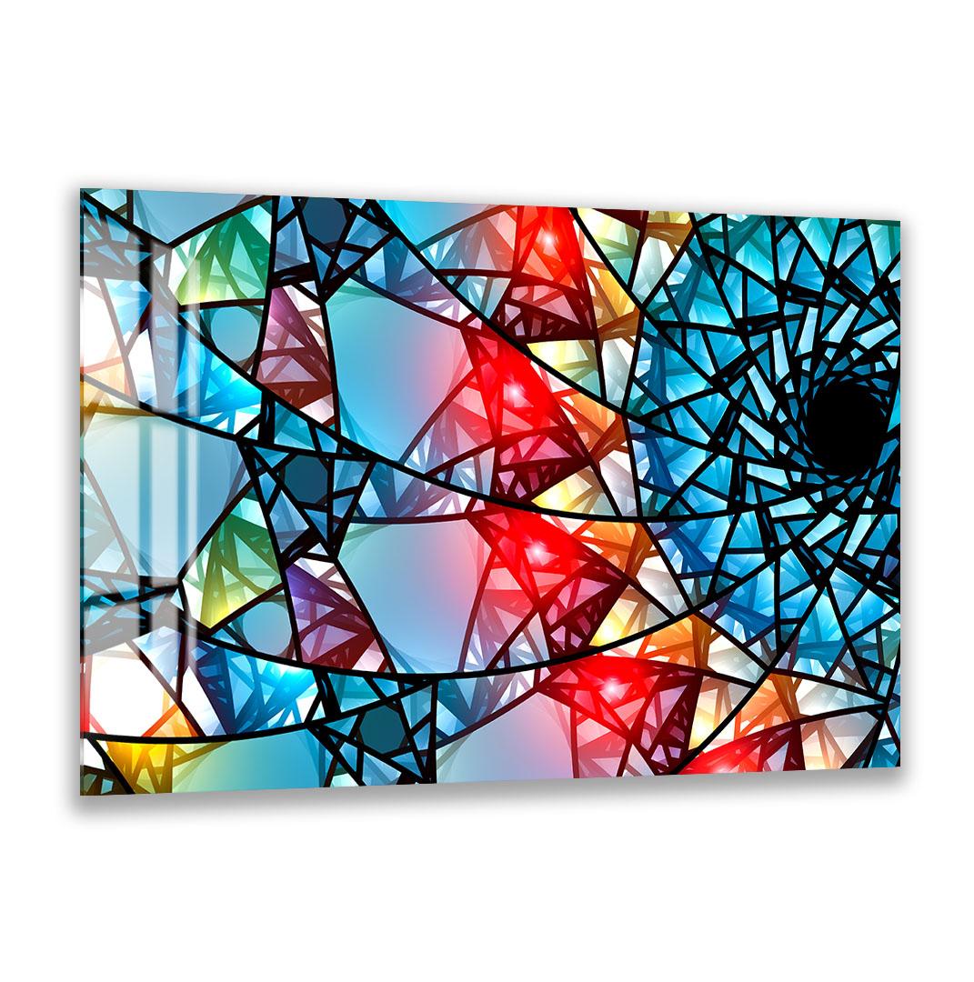 The image is a vibrant and colorful abstract artwork composed of various geometric shapes and patterns, including triangles, rectangles, and circles, arranged in a visually striking manner.
