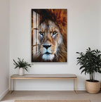 a large, detailed painting of a lion's face hanging on a white wall. The painting is the central focus of the room, with a wooden bench in the foreground and two potted plants on either side.