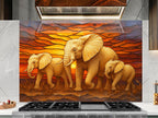 a painting of three elephants in front of a sunset