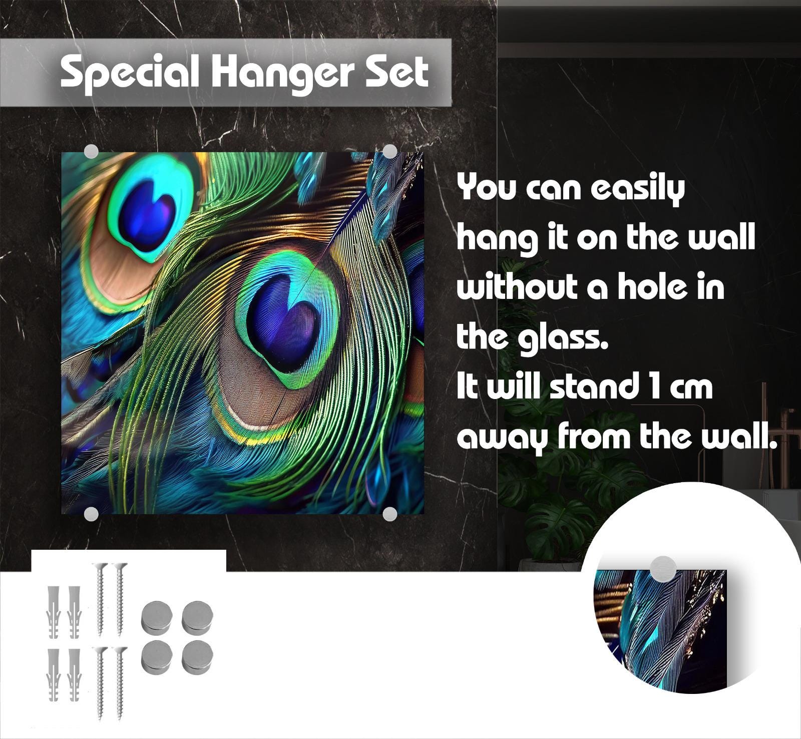 The image is a close-up of a vibrant peacock feather, showcasing its intricate details and vivid colors. The text above the image reads &quot;Special Hanger Set&quot; and below it, the text states that the peacock feather can be easily hung on the wall without a hole in the glass, and it will stand 1 cm away from the wall.