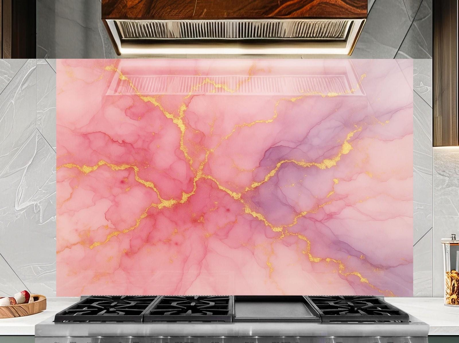 a kitchen stove top with a pink and gold marble design