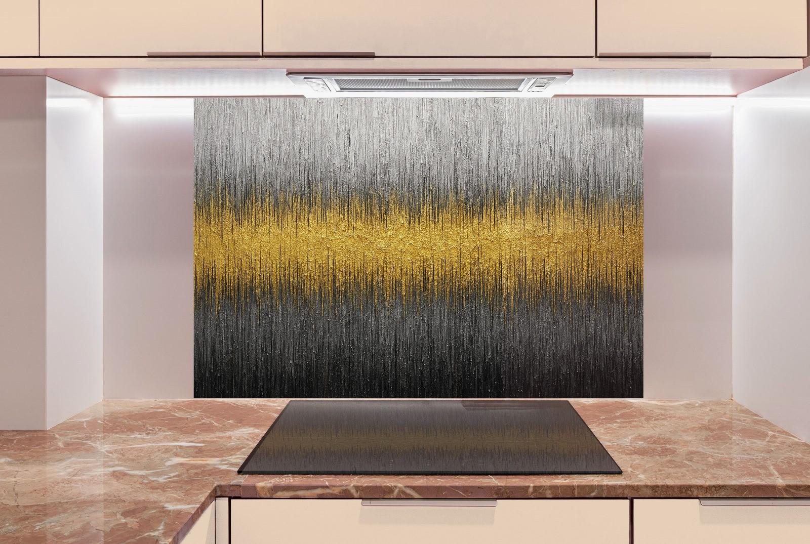 a kitchen with marble counter tops and a painting on the wall