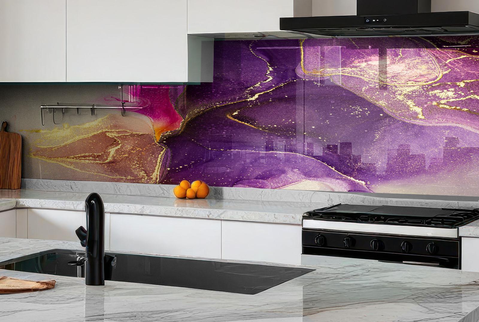 a modern kitchen with a striking purple and gold marble backsplash. The backsplash has a swirling pattern that adds a sense of movement and energy to the space. The kitchen is equipped with a gas range, a sink, and a wooden cutting board. There are also some oranges placed on the countertop, adding a pop of color to the scene.