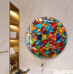 a bathroom with a large, colorful mosaic-like artwork hanging on the wall. The artwork consists of various shapes and colors, creating a vibrant and eye-catching display.