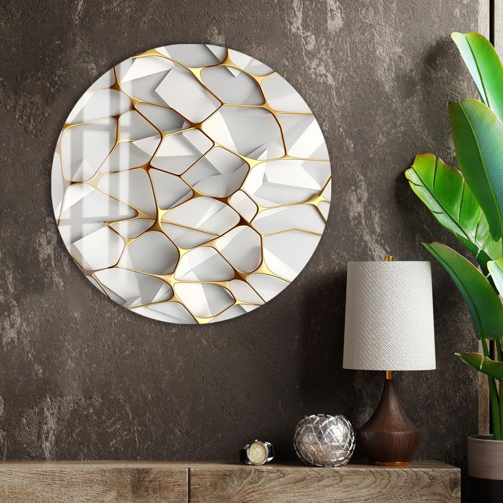 a modern interior design with a large circular wall art piece featuring a geometric pattern in white and gold colors. The art piece is mounted on a dark wall, and there is a lamp and a plant in the foreground, creating a cozy and stylish atmosphere.