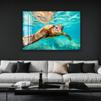 a large, detailed photograph of an elephant's face, mounted on a wall above a modern, minimalist living room setting with a white sofa and a glass coffee table.