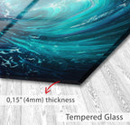 a glass surface with a textured, turquoise-colored pattern.
