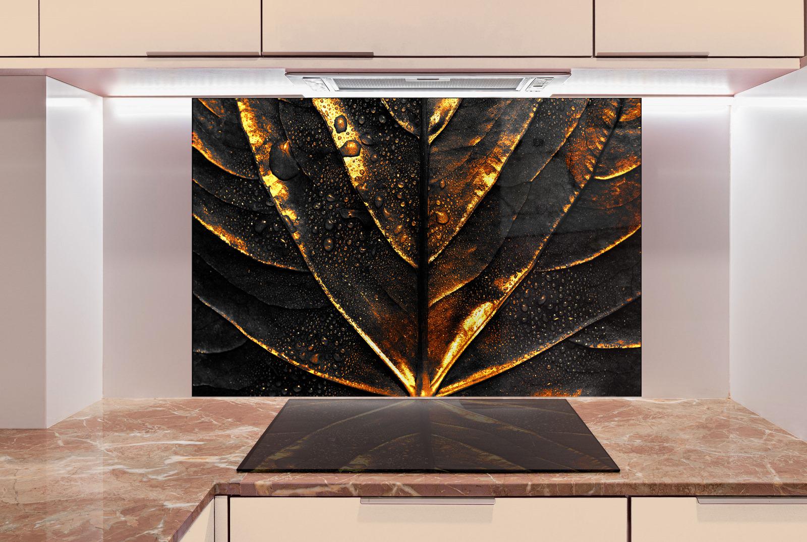 a large, striking black and gold leaf-like pattern on a wall, creating a visually captivating and modern design element in the kitchen.