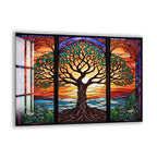 A vibrant stained glass window depicting a tree with intricate patterns and designs, set against a colorful sunset landscape.